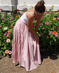Suitcase ready withy pretty in pink pleats. Flow from business to leisure.
