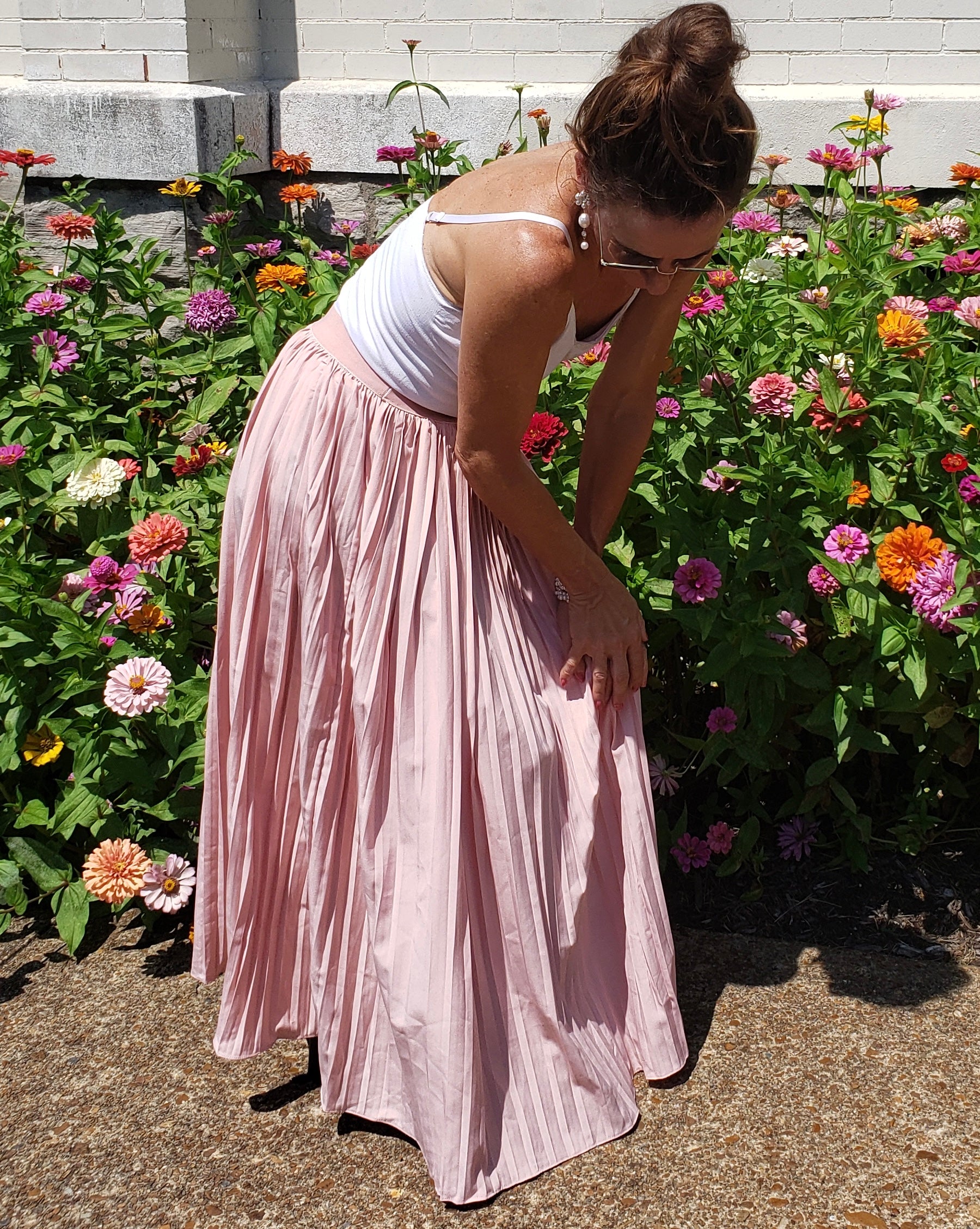 Suitcase ready withy pretty in pink pleats. Flow from business to leisure.