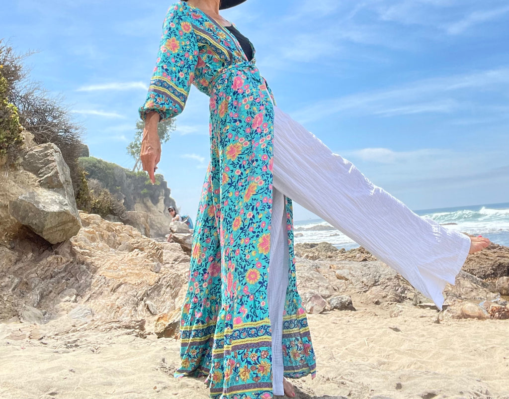 Blue feminine flow with slight ruffles packed for a  wedding, beach a tour abroad.