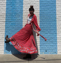Kicking it up with red & slight ruffles from the plane, to business, a wedding  to the beach