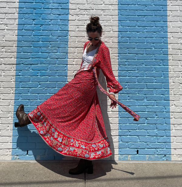 Kicking it up with red & slight ruffles from the plane, to business, a wedding  to the beach